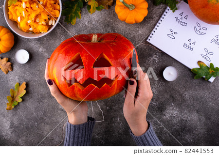 Process of making Halloween jack-o-lantern 82441553