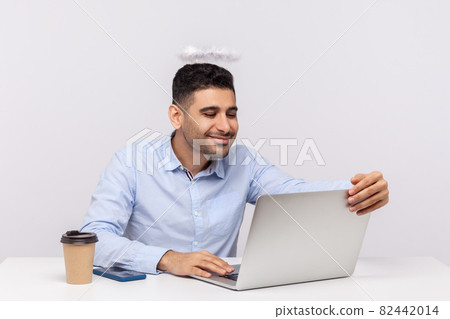 Emotional man sitting and working on office Emotional man sitting and working on office 82442014