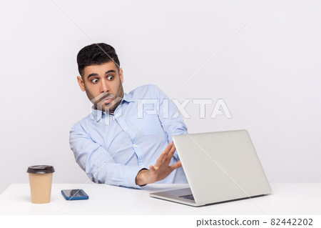 Emotional man sitting and working on office 82442202