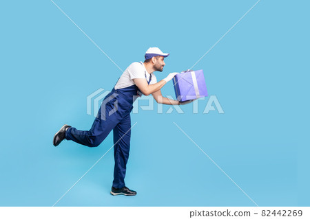 Portrait of worker man in uniform on blue background. Portrait of worker man in uniform on blue background. 82442269