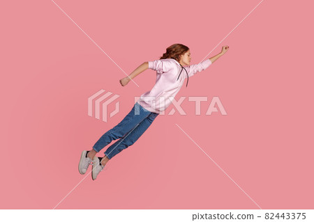 Portrait of young emotional woman on pink background. 82443375