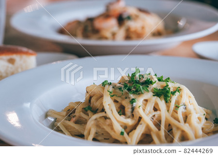 Cream pasta lunch next to the image cut Cream pasta lunch next to the image cut 82444269