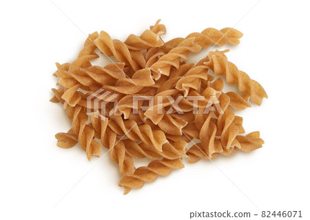 Wolegrain fusilli pasta from durum wheat isolated on white background with clipping path and full depth of field. Top view. Flat lay. Wolegrain fusilli pasta from durum wheat isolated on white background with clipping path and full depth of field. Top view. Flat lay. 82446071