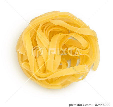 Raw tagliatelle pasta isolated on white background with clipping path and full depth of field. Top view. Flat lay 82446090
