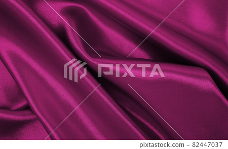 Smooth elegant pink silk or satin luxury cloth texture as abstract background. Luxurious valentines day background design 82447037
