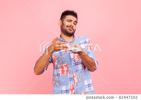 Portrait of emotional bearded man on pink background. Portrait of emotional bearded man on pink background. 82447102