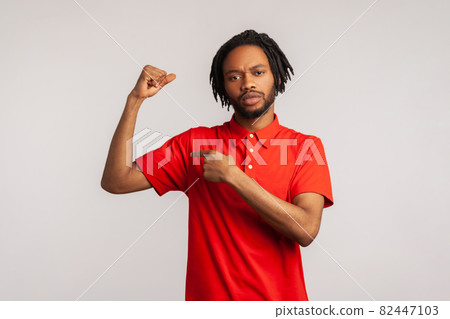 Portrait of young emotional african man on gray background. Portrait of young emotional african man on gray background. 82447103