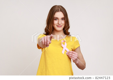 Portrait of young emotional woman on gray background. Portrait of young emotional woman on gray background. 82447123