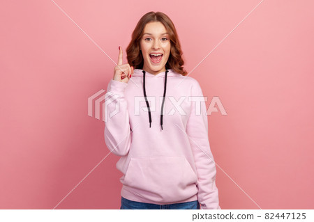 Portrait of young emotional woman on pink background. Portrait of young emotional woman on pink background. 82447125