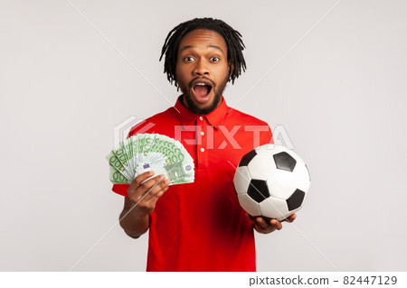 Portrait of young emotional african man on gray background. Portrait of young emotional african man on gray background. 82447129
