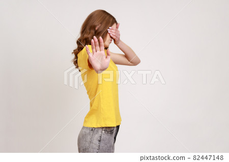 Portrait of young emotional woman on gray background. Portrait of young emotional woman on gray background. 82447148