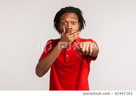 Portrait of young emotional african man on gray background. Portrait of young emotional african man on gray background. 82447161
