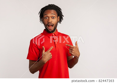 Portrait of young emotional african man on gray background. Portrait of young emotional african man on gray background. 82447163