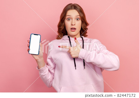 Portrait of young emotional woman on pink background. Portrait of young emotional woman on pink background. 82447172