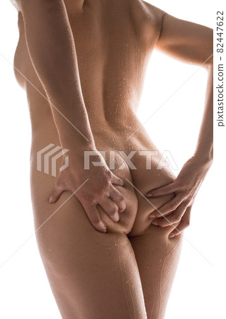 Seductive naked woman with hands on buttocks Seductive naked woman with hands on buttocks 82447622