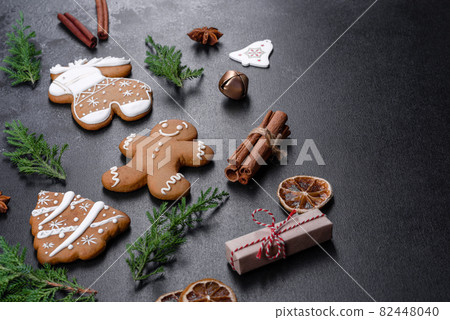 Christmas festive gingerbread made at home on a dark table Christmas festive gingerbread made at home on a dark table 82448040
