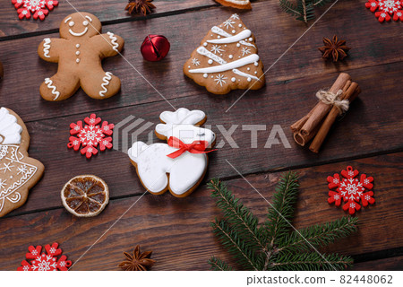 Christmas festive gingerbread made at home on a dark table Christmas festive gingerbread made at home on a dark table 82448062