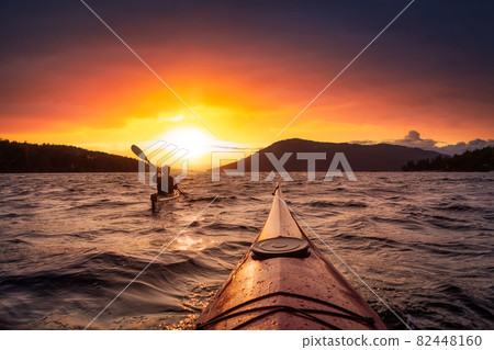 Adventurous Woman on Sea Kayak paddling in the Pacific Ocean. 82448160