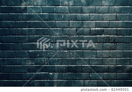 Black old tiled wall lit by sunlight 82449501