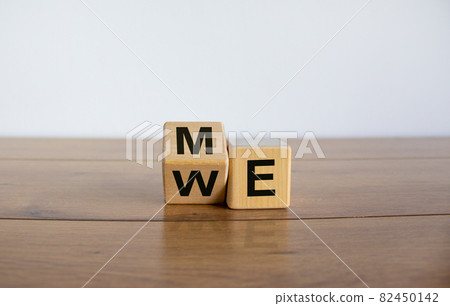 Expanded wood cube with 'me' or 'we' words on beautiful wooden table, white background, copy space. Expanded wood cube with 'me' or 'we' words on beautiful wooden table, white background, copy space. 82450142