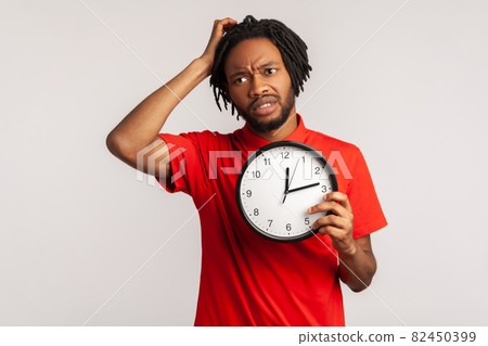 Portrait of young emotional african man on gray background. 82450399