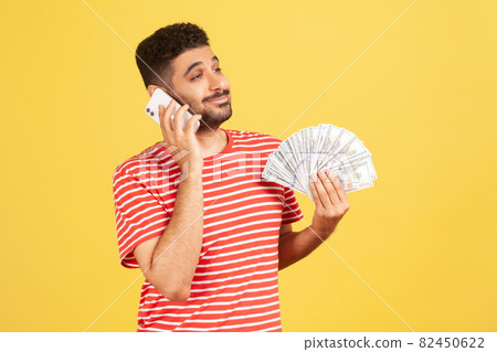 Emotional young man in red t-shirt on yellow background. Emotional young man in red t-shirt on yellow background. 82450622