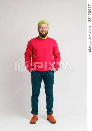 Hipster emotional man with green head on gray background. 82450637