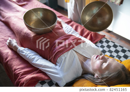 Tibetan singing bowls in sound therapy in spa center 82451165