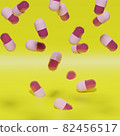 隨機落下的粉紅色 3D 膠囊，黃色背景 82456517