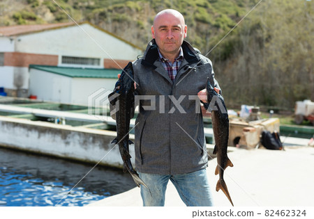 Man demonstrating sturgeon Man demonstrating sturgeon 82462324