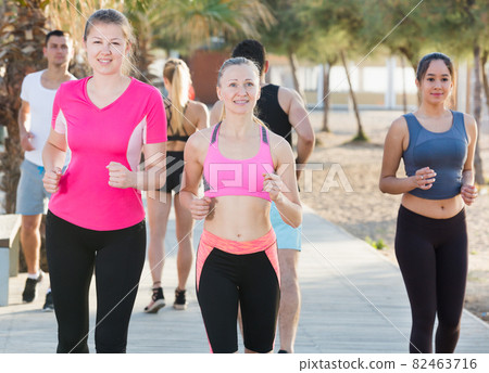 People jogging on city seafront 82463716