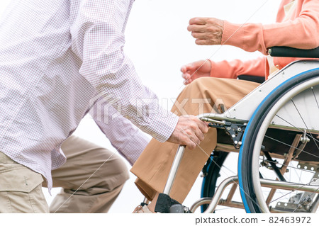 Senior couple, elderly care, outdoors at hand 82463972