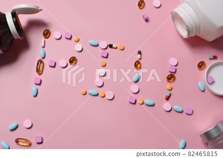 Assorted medicine pills on pink background. Assorted medicine pills on pink background. 82465815