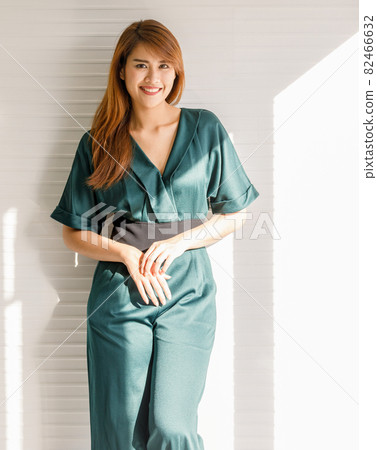 Portrait of young and cute Asain girl with long hair pose in friendly and confident gesture 82466632