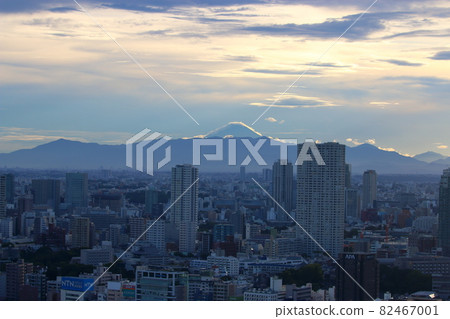 View of Mt. Fuji as seen from central Tokyo Japan showing the city with the sun setting behind Fuji-san View of Mt. Fuji as seen from central Tokyo Japan showing the city with the sun setting behind Fuji-san 82467001