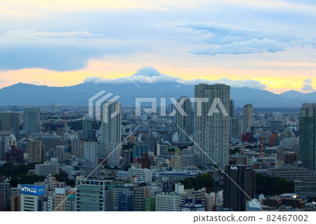 View of Mt. Fuji as seen from central Tokyo Japan showing the city with the sun setting behind Fuji-san 82467002