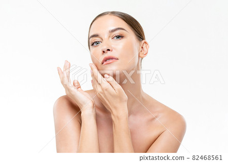 Caucasian woman with smooth fresh glowing skin touching face for beauty and skincare concepts Caucasian woman with smooth fresh glowing skin touching face for beauty and skincare concepts 82468561