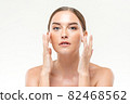 Beauty shot of clear glowing skin woman touching her face for skincare concepts 82468562
