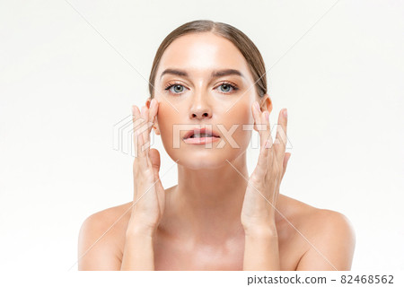 Beauty shot of clear glowing skin woman touching her face for skincare concepts Beauty shot of clear glowing skin woman touching her face for skincare concepts 82468562
