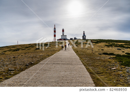 Hikers climbing up a mountain road in Navacerrada 82468930