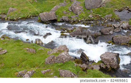 Fast flowing river at the bottom of the Dynjandi. The Dynjandi is the most famous waterfall of the West Fjords, Iceland Fast flowing river at the bottom of the Dynjandi. The Dynjandi is the most famous waterfall of the West Fjords, Iceland 82469861