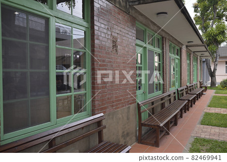 Garden landscape of red brick retro-style building 82469941