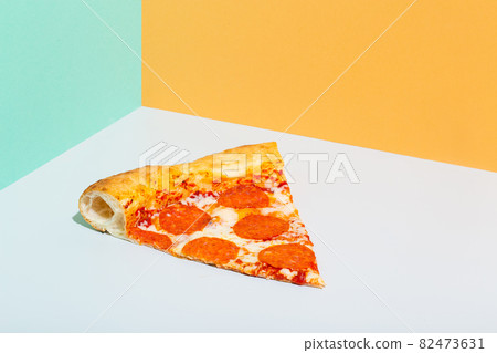 Slice of Pepperoni Pizza orange grey turquoise paper background modern 82473631