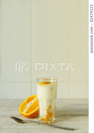 Natural yoghurt with fresh orange Natural yoghurt with fresh orange 82474225