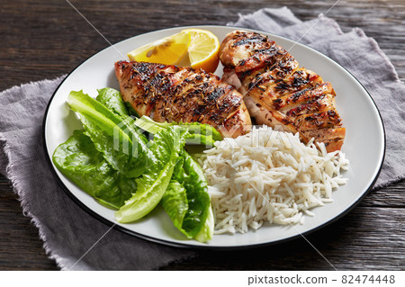 seared chicken breasts with lettuce and rice seared chicken breasts with lettuce and rice 82474448