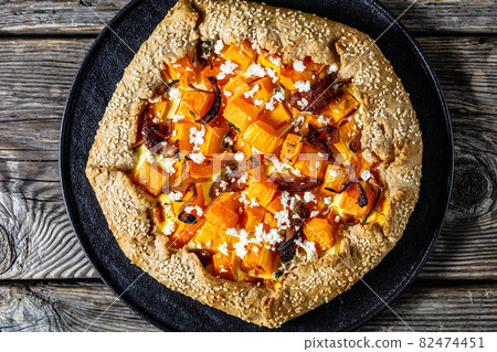 pumpkin galette with onion and feta cheese pumpkin galette with onion and feta cheese 82474451