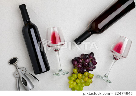 Two glasses of red wine and grapes. Top view Two glasses of red wine and grapes. Top view 82474945