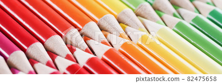 Multicolored set of wooden pencils lying diagonally 82475658