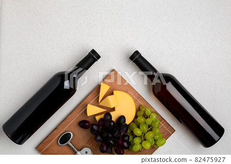 Bottles of red and white wine on white background from top view 82475927