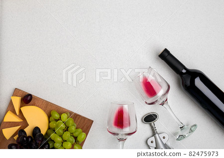 Wine, glasses and corkscrew over white background. Top view Wine, glasses and corkscrew over white background. Top view 82475973